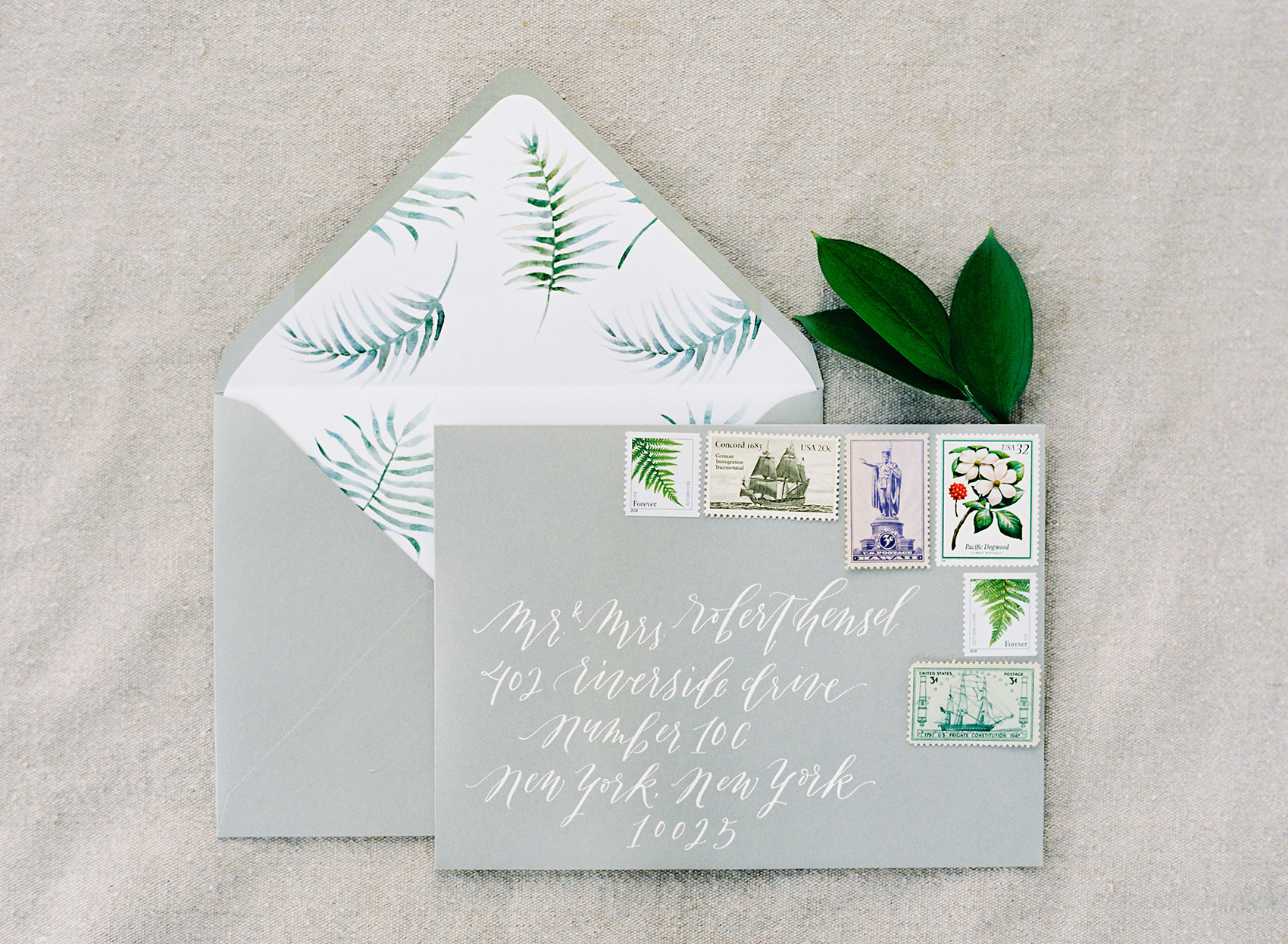 la Happy Design & calligraphy custom envelops with vintage postage